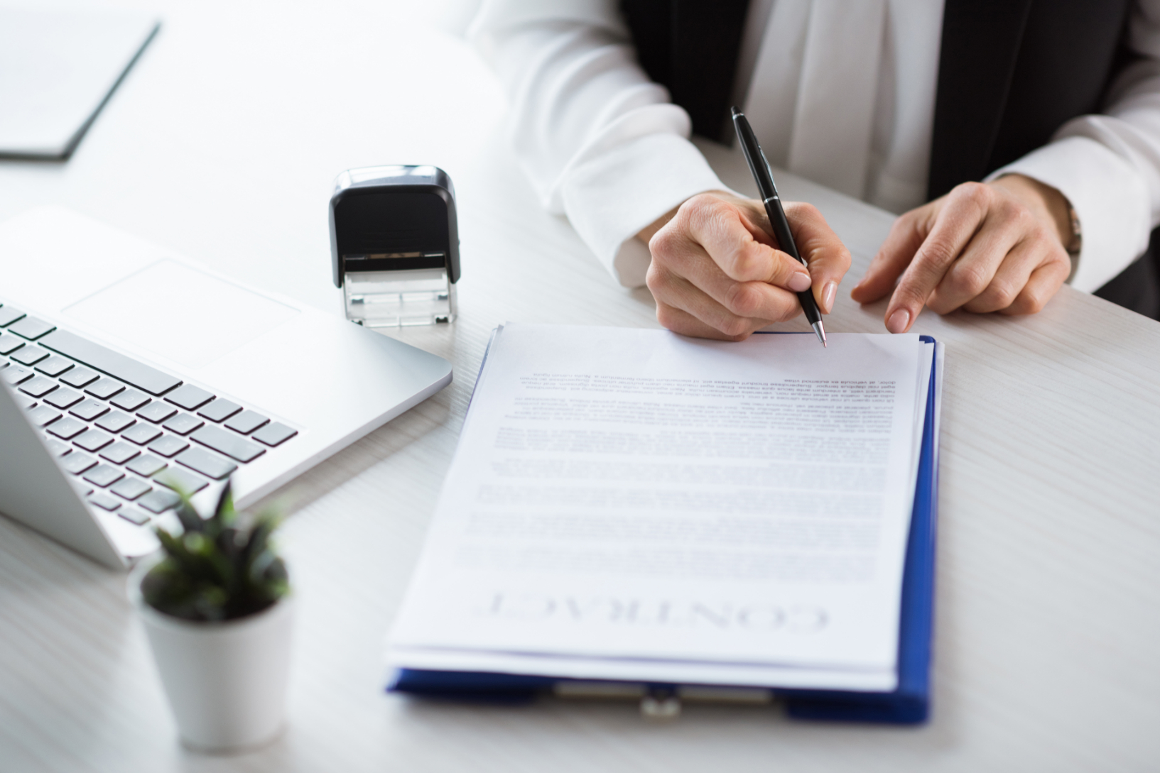 Businesswoman signing contract